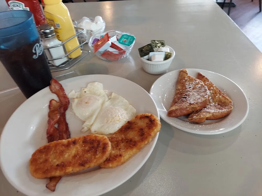 Eggs Bacon Hash Browns and French Toast